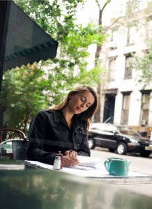 Woman enjoying a beautiful day at a cafe